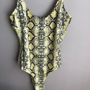 Neon yellow, bodycon snake print bodysuit.